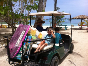 kid with parents on golf kart