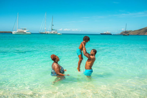 family playing at beach