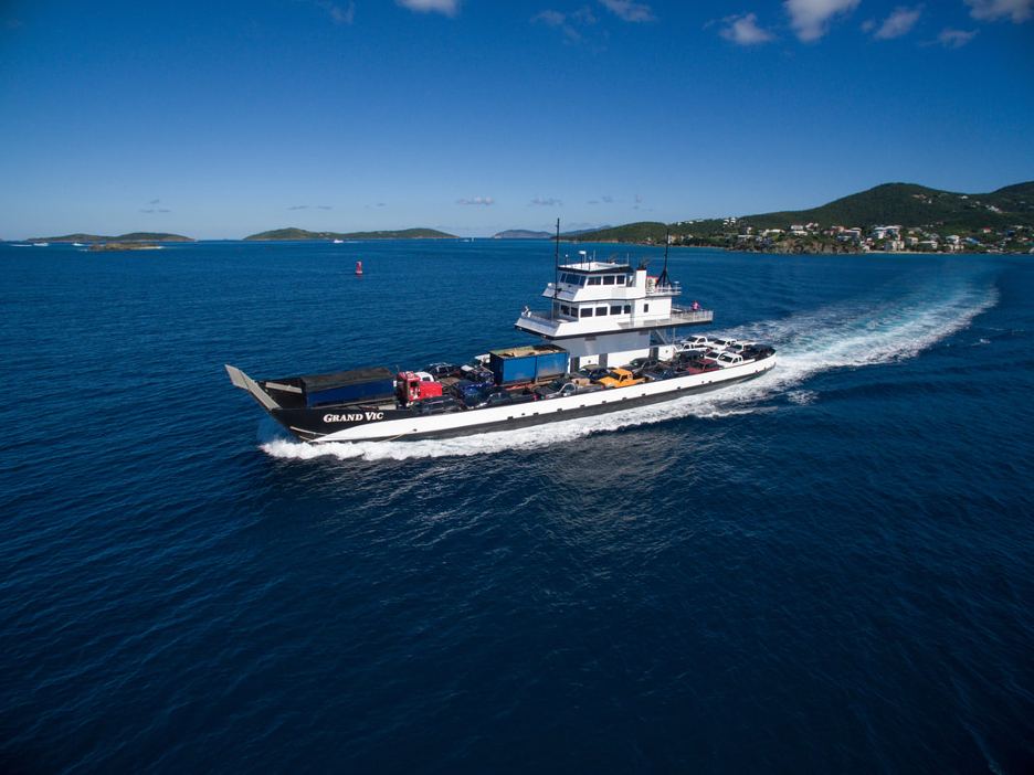 A barge on the ocean going to an island